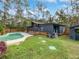 Inviting backyard with a swimming pool and a pergola-covered patio at 14421 Parker Rd, Orlando, FL 32832