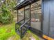 Screened porch with wooden stairs at 14421 Parker Rd, Orlando, FL 32832