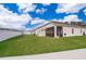 Spacious backyard with grassy lawn and screened patio at 1550 Outback Rd, St Cloud, FL 34771