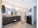 Spa-like bathroom with a double vanity, walk-in shower, and separate toilet area at 1550 Outback Rd, St Cloud, FL 34771
