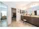 Double vanity bathroom with granite countertops and walk-in shower at 1550 Outback Rd, St Cloud, FL 34771