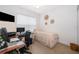 Bright bedroom with window blinds, workspace, and neutral decor at 1550 Outback Rd, St Cloud, FL 34771