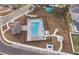 Aerial view of community pool with lounge chairs and landscaping at 1550 Outback Rd, St Cloud, FL 34771