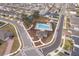 Aerial view of community pool and surrounding neighborhood at 1550 Outback Rd, St Cloud, FL 34771