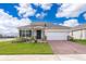 One-story home with brick paver driveway and landscaped front yard at 1550 Outback Rd, St Cloud, FL 34771