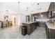 Modern kitchen with island and stainless steel appliances at 1550 Outback Rd, St Cloud, FL 34771