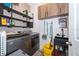 Laundry room with washer, dryer, shelving, and utility sink at 1550 Outback Rd, St Cloud, FL 34771