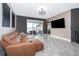 Living room with a sectional sofa, and sliding glass doors leading to a patio at 1550 Outback Rd, St Cloud, FL 34771
