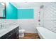 Bathroom with white subway tile, a clawfoot tub, and dark vanity at 1601 New York Ave., St Cloud, FL 34769