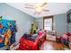 bedroom with race car bed, toys, and light blue walls at 1601 New York Ave., St Cloud, FL 34769