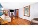 Living room features hardwood floors, light beige couch, and wooden coffee table at 1601 New York Ave., St Cloud, FL 34769