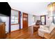 Living room with hardwood floors, light beige couch, and wooden coffee table at 1601 New York Ave., St Cloud, FL 34769