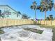 Large backyard with a concrete patio and wooden fence at 17 S Oleander Ave, Daytona Beach, FL 32118