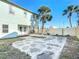 Large backyard with concrete patio and wooden fence at 17 S Oleander Ave, Daytona Beach, FL 32118