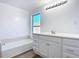 Clean bathroom with white vanity and bathtub at 17 S Oleander Ave, Daytona Beach, FL 32118