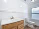 Clean bathroom with wood-look floors and updated vanity at 17 S Oleander Ave, Daytona Beach, FL 32118