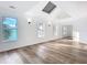 Spacious bedroom featuring hardwood floors, skylights, and multiple windows at 17 S Oleander Ave, Daytona Beach, FL 32118