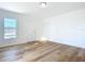 Bright bedroom featuring hardwood floors and a door at 17 S Oleander Ave, Daytona Beach, FL 32118
