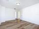 Simple bedroom with hardwood floors and a door at 17 S Oleander Ave, Daytona Beach, FL 32118