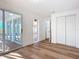 Bedroom with sliding glass doors, and ample closet space at 17 S Oleander Ave, Daytona Beach, FL 32118