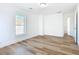 Spacious bedroom with hardwood floors and a door at 17 S Oleander Ave, Daytona Beach, FL 32118