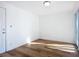 Bright bedroom with wood-look floors and sliding glass doors at 17 S Oleander Ave, Daytona Beach, FL 32118
