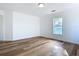 Bright bedroom with hardwood floors and a window at 17 S Oleander Ave, Daytona Beach, FL 32118