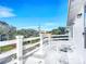 White deck with white railing and city view at 17 S Oleander Ave, Daytona Beach, FL 32118