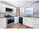 Newly renovated kitchen, featuring white cabinets and granite countertops at 17 S Oleander Ave, Daytona Beach, FL 32118