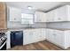 Modern kitchen with white cabinets and granite countertops at 17 S Oleander Ave, Daytona Beach, FL 32118
