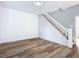 Living room with hardwood floors and staircase at 17 S Oleander Ave, Daytona Beach, FL 32118
