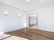Bright living room with hardwood floors and white walls at 17 S Oleander Ave, Daytona Beach, FL 32118