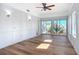 Sunlit living room with hardwood floors and sliding glass doors at 17 S Oleander Ave, Daytona Beach, FL 32118