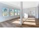 Spacious living area with hardwood floors and access to the exterior at 17 S Oleander Ave, Daytona Beach, FL 32118