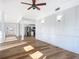 Open living room with hardwood floors and a view of the kitchen at 17 S Oleander Ave, Daytona Beach, FL 32118