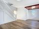 Bright living room featuring hardwood floors and a staircase at 17 S Oleander Ave, Daytona Beach, FL 32118