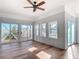 Bright living room with hardwood floors and multiple windows at 17 S Oleander Ave, Daytona Beach, FL 32118
