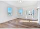 Living room with hardwood floors, white walls, and front door at 17 S Oleander Ave, Daytona Beach, FL 32118