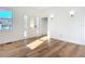 Living room with hardwood floors, white walls, and front door at 17 S Oleander Ave, Daytona Beach, FL 32118