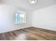 Living room with bay window and hardwood floors at 17 S Oleander Ave, Daytona Beach, FL 32118