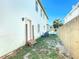 Side yard with small steps leading to a back door at 17 S Oleander Ave, Daytona Beach, FL 32118