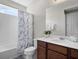 Clean bathroom with shower/tub combo, vanity, and window at 1808 Sandy Park Trl, Kissimmee, FL 34747