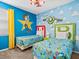 Toy Story themed bedroom with twin beds and playful decor at 1808 Sandy Park Trl, Kissimmee, FL 34747