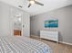 Bedroom with dresser, TV and king-size bed at 1808 Sandy Park Trl, Kissimmee, FL 34747