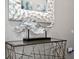 Modern entryway console table with decorative items at 1808 Sandy Park Trl, Kissimmee, FL 34747