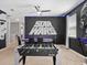 Star Wars themed game room with foosball and poker table at 1808 Sandy Park Trl, Kissimmee, FL 34747