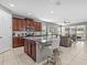 Open kitchen with granite countertops and stainless steel appliances at 1808 Sandy Park Trl, Kissimmee, FL 34747