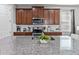 Kitchen with stainless steel appliances and wood cabinets at 1808 Sandy Park Trl, Kissimmee, FL 34747