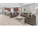 Spacious living room with comfortable sofas and large windows at 1808 Sandy Park Trl, Kissimmee, FL 34747