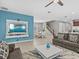 Open concept living space with a modern TV stand at 1808 Sandy Park Trl, Kissimmee, FL 34747